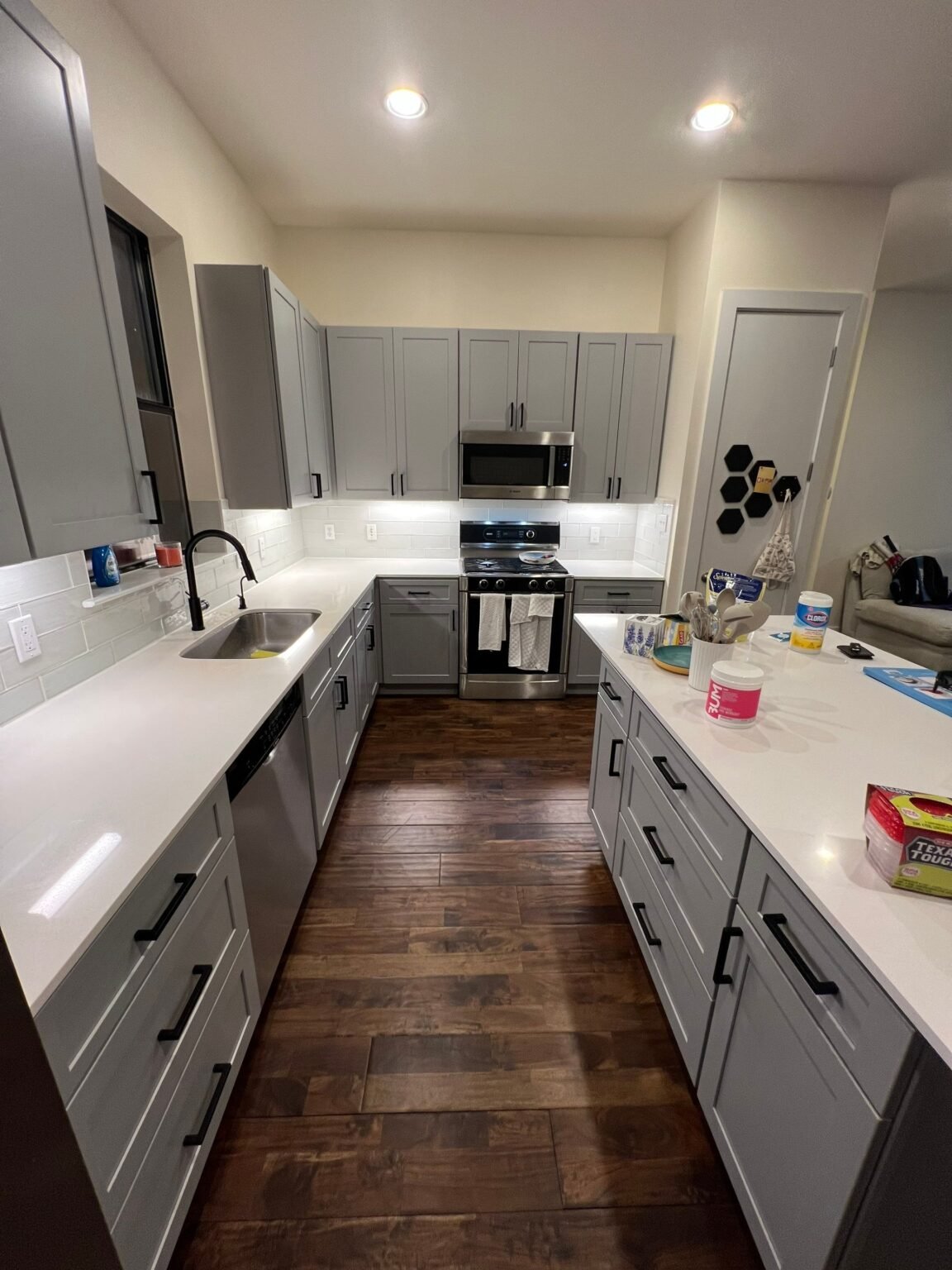 The same Austin kitchen after water damage restoration: rebuilt cabinets, counters and flooring